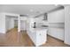 Open kitchen with a large island, stainless steel appliances, ample cabinetry, and seamless flow into the adjacent living spaces at 16810 W Yucatan Dr, Surprise, AZ 85388