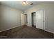 The bedroom is adorned with neutral walls, soft carpet, and a closet, creating a warm and inviting space at 1730 W Pollack St, Phoenix, AZ 85041