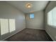 Bedroom with soft carpet, neutral walls, and a sunlit window at 1730 W Pollack St, Phoenix, AZ 85041