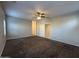 Large bedroom featuring a ceiling fan, carpet, and an open doorway to adjoining spaces at 1730 W Pollack St, Phoenix, AZ 85041