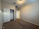 A bedroom featuring neutral walls, a plush carpet, and a closet with sliding doors at 1730 W Pollack St, Phoenix, AZ 85041