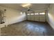 Spacious garage with concrete floors, white walls, and a large garage door with windows at 1730 W Pollack St, Phoenix, AZ 85041
