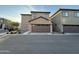 Attached two-car garage with neutral door color complementing the home's exterior at 1730 W Pollack St, Phoenix, AZ 85041