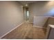 Upper hallway featuring plush carpet and neutral-colored walls with passageway to other rooms at 1730 W Pollack St, Phoenix, AZ 85041