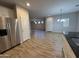 Kitchen showcasing stainless steel appliances and a seamless flow to the living area at 1730 W Pollack St, Phoenix, AZ 85041