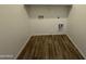 Interior view of laundry room with hookups and wood-look tile flooring at 1730 W Pollack St, Phoenix, AZ 85041