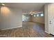 Open-concept living room with wood-look tile flooring and lots of natural light at 1730 W Pollack St, Phoenix, AZ 85041