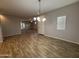 Open-concept living space with wood tile flooring, recessed lighting, and ample natural light at 1730 W Pollack St, Phoenix, AZ 85041