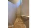 A carpeted staircase with handrails guides you downwards, blending safety with a modern design aesthetic at 1730 W Pollack St, Phoenix, AZ 85041