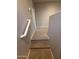 Carpeted staircase with white banister leading to an upper floor at 1730 W Pollack St, Phoenix, AZ 85041