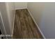 Small storage area with wood-look tile flooring and white walls at 1730 W Pollack St, Phoenix, AZ 85041