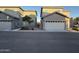 Street view of residences featuring attached garages, desert landscaping, and stucco exteriors at 1730 W Pollack St, Phoenix, AZ 85041
