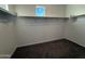 Walk-in closet with shelving and a window, providing ample storage and natural light at 1730 W Pollack St, Phoenix, AZ 85041