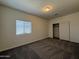 Bedroom features carpeted floors and a closet, creating a comfortable space to unwind and relax at 1738 W Pollack St, Phoenix, AZ 85041