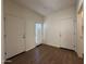 Bedroom with plank flooring, two closet doors, and a door to the backyard at 1738 W Pollack St, Phoenix, AZ 85041