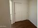Bright room featuring a large white double-door closet and base trim with wood floors at 1738 W Pollack St, Phoenix, AZ 85041