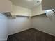 Walk-in closet with carpeted floors, white walls, and closet organizers to keep your wardrobe neat at 1738 W Pollack St, Phoenix, AZ 85041