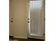 Neutral-toned glass-paneled door and adjacent door in the hallway, offering natural light and accessibility at 1738 W Pollack St, Phoenix, AZ 85041