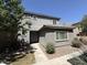 Two-story home with stucco exterior, tiled roof, neat front yard with shrubs, and a walkway to the entry at 1738 W Pollack St, Phoenix, AZ 85041