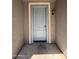 Close-up of a neutral blue front door with sidelight and an entryway light fixture providing a welcoming entrance at 1738 W Pollack St, Phoenix, AZ 85041