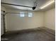 Spacious garage featuring a modern door opener, bright lighting and plenty of room for storage or vehicles at 1738 W Pollack St, Phoenix, AZ 85041