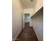 Narrow hallway with utility shelves leading to a rear patio at 1738 W Pollack St, Phoenix, AZ 85041
