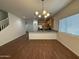 Bright dining area features wood floors and modern lighting, connecting to the kitchen at 1738 W Pollack St, Phoenix, AZ 85041