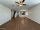 Spacious living room with wood floors, ceiling fan, and easy access to the kitchen at 1738 W Pollack St, Phoenix, AZ 85041