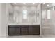 Bathroom featuring double sinks, and a spacious tiled shower at 17615 W Palo Verde Dr, Litchfield Park, AZ 85340