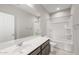 Bathroom with a large mirror, tile floors, a bathtub, and a shower at 17615 W Palo Verde Dr, Litchfield Park, AZ 85340