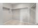 Walk-in closet features ample shelving and neutral carpeting at 17615 W Palo Verde Dr, Litchfield Park, AZ 85340