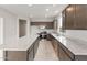 Modern kitchen featuring stainless steel appliances, spacious countertops, and ample cabinet space at 17615 W Palo Verde Dr, Litchfield Park, AZ 85340