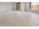 Spacious living room with tile flooring, a sliding door, and a window at 17615 W Palo Verde Dr, Litchfield Park, AZ 85340