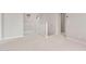Open loft area with neutral carpet and bright natural light at 17615 W Palo Verde Dr, Litchfield Park, AZ 85340