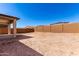 Large, unfinished backyard, enclosed by a block wall, is a blank canvas ready for customization and landscaping at 18486 E Dario Rd, Gold Canyon, AZ 85118