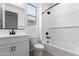 Bright bathroom featuring a modern vanity, toilet, and shower-tub combination with white subway tile at 18486 E Dario Rd, Gold Canyon, AZ 85118