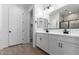 Modern bathroom featuring double sinks, white cabinets, and a spacious walk-in shower at 18486 E Dario Rd, Gold Canyon, AZ 85118
