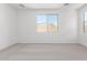 Comfortable bedroom with soft carpeting and large windows, perfect for relaxation and natural light at 18486 E Dario Rd, Gold Canyon, AZ 85118