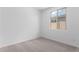 Cozy bedroom with a window, neutral carpet, and light-filled space at 18486 E Dario Rd, Gold Canyon, AZ 85118