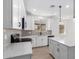 Modern kitchen showcasing white cabinets, stainless steel appliances, quartz countertops, and an undermount sink at 18486 E Dario Rd, Gold Canyon, AZ 85118