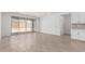 Spacious living room with tile flooring and sliding glass doors leading to the backyard patio at 18486 E Dario Rd, Gold Canyon, AZ 85118
