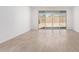 Bright living room featuring tile flooring and sliding glass doors leading to the backyard at 18486 E Dario Rd, Gold Canyon, AZ 85118