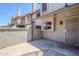 Enclosed back patio with stucco walls, offering privacy and outdoor living space at 1961 N Hartford St # 1055, Chandler, AZ 85225
