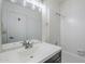 Bathroom with white vanity, mirrored medicine cabinet, tub and tiled shower at 1961 N Hartford St # 1055, Chandler, AZ 85225