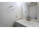 Updated bathroom features a grey vanity, white sink and updated lighting at 1961 N Hartford St # 1055, Chandler, AZ 85225