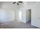 Spacious bedroom with vaulted ceiling and ceiling fan; doorway and sliding closet are visible at 1961 N Hartford St # 1055, Chandler, AZ 85225