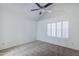 Bedroom with neutral carpet, vaulted ceiling and natural light from arched shuttered window at 1961 N Hartford St # 1055, Chandler, AZ 85225