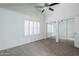 Bedroom with neutral carpet, window with shutters and mirrored closet at 1961 N Hartford St # 1055, Chandler, AZ 85225