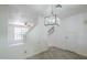 Open dining room features tile floors, white walls and a decorative pendant lighting fixture at 1961 N Hartford St # 1055, Chandler, AZ 85225