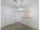 Bright dining room features tile floors, white walls and a decorative pendant lighting fixture at 1961 N Hartford St # 1055, Chandler, AZ 85225